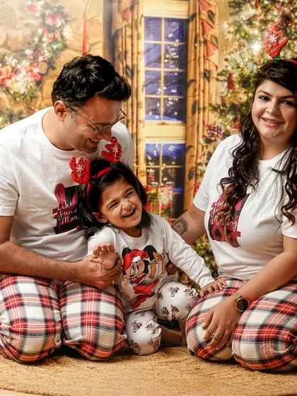 Our themed mini sessions are all about creating joyful memories. This family's laughter during our Christmas postcard shoot shows how much fun we have bringing festive ideas to life.