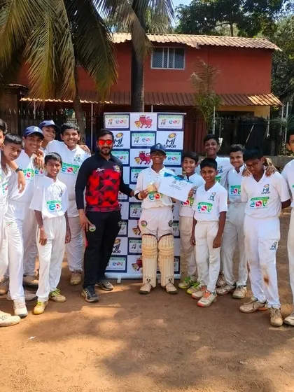 The team celebrating Mayur Shetty's 'Best Bowler' award in the MI Junior U-14 tournament.