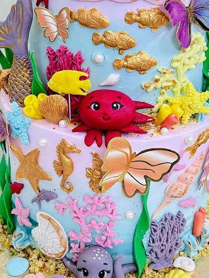 A detailed shot of the bottom tier, featuring a cute red crab and purple octopus.
