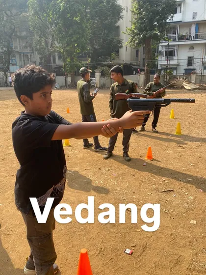 Vedang gets comfortable with the pistol, learning a new skill in a safe environment.