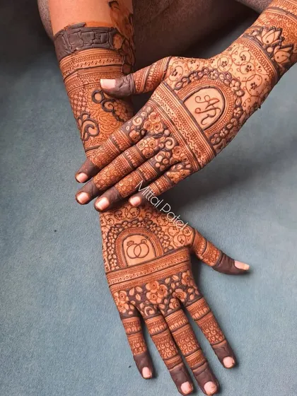 A beautiful engagement design with a dark stain, showcasing the couple's initials and ring symbols in a semi-traditional, semi-modern style.
