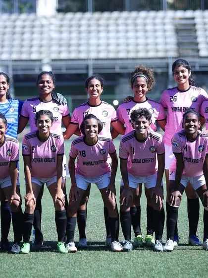 Our starting XI in the classic pink jerseys, lined up and ready for the game.