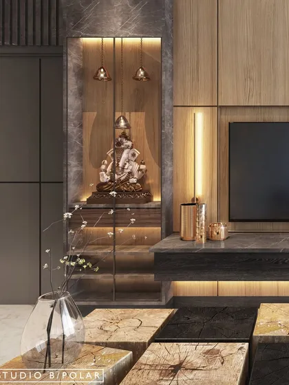We often integrate spaces for worship seamlessly into our designs. Here, a beautiful Ganesha idol is housed in a custom-lit niche next to the TV unit, making it a divine focal point.