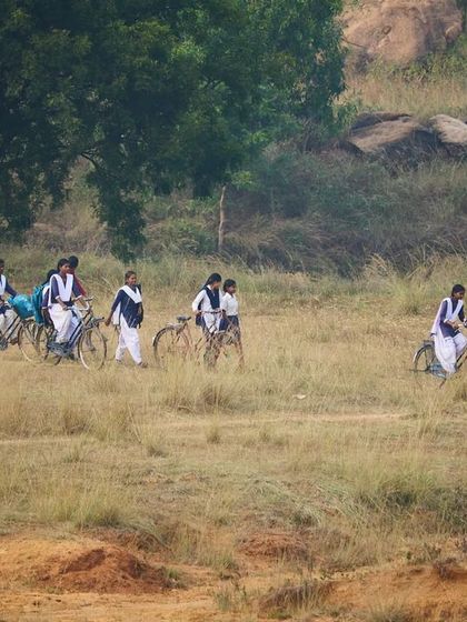 Another shot of the girls arriving on their bicycles, ready for a new adventure. We hope to continue working with them in the future.