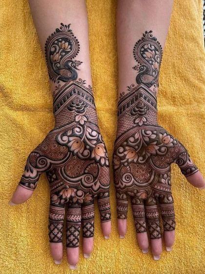 A symmetrical design featuring peacocks and lotuses, perfect for festivals or as a guest at a wedding.