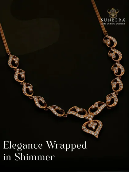 Elegance wrapped in shimmer, this gold and diamond necklace features a flowing, heart-centric design. The paisley-like motifs are studded with diamonds, creating a piece that is both graceful and glamorous.