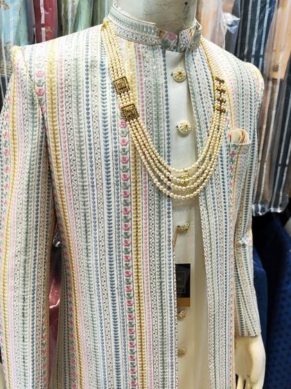 Another angle of the multi-color striped open sherwani, showing how the different colors in the embroidery can be paired with various accessories.