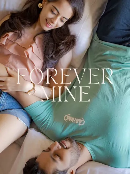 A sweet and intimate shot of a couple lying together, with "Forever Mine" elegantly written over the image. This is a beautiful and romantic way to capture a quiet, personal moment.