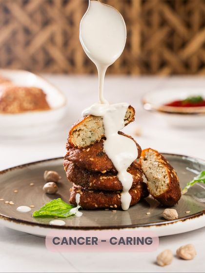 Cancer, you are caring. Just like this comforting stack of falafel drizzled with tahini.