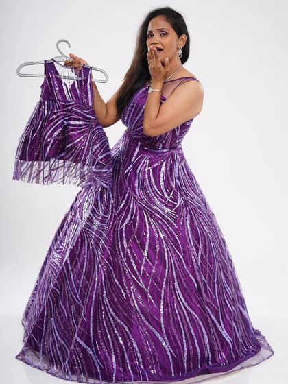 Twin with your little one in this glamorous purple sequin gown set. The "shooting star" pattern makes it a fun and unique choice for parties and special occasions.