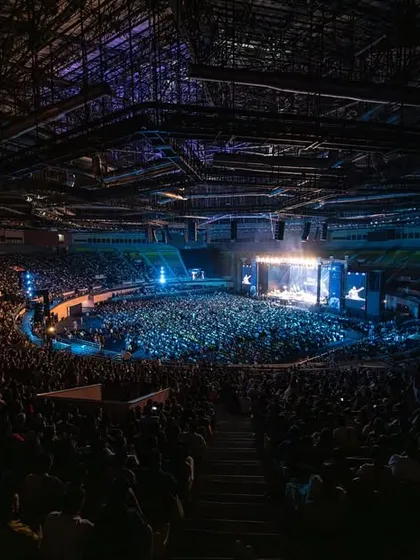 Another perspective of the massive crowd in Delhi, showing the circular stage design that helps create a more intimate connection even in a huge arena.