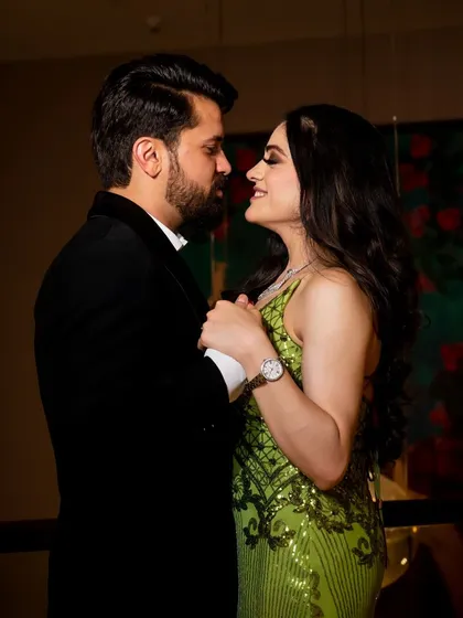 A close up, intimate shot of the couple, capturing the loving gaze they share.