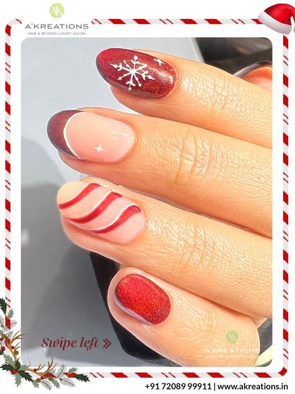 A detailed look at the mixed-design Christmas manicure, showing the clean lines of the candy cane stripes and the sparkle of the snowflake.