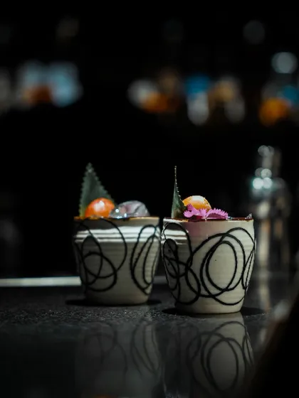 Our Calendula Punch is a floral and sparkling delight. It features Marigold Gin, Peach Liqueur, citrus, and is topped with sparkling wine for a bright, celebratory feel.