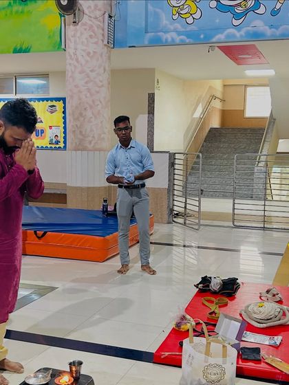 I am seen here offering prayers during the Dussehra puja at our center. It is important for us to honor our traditions and instill these values in our students.