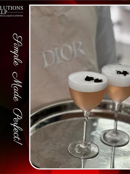 A close-up of the beautifully crafted cocktails with foam and floral garnish, designed exclusively for DIOR.