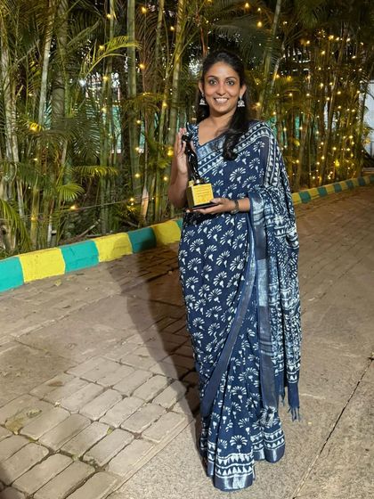 A full-length photo of me with my award. This journey as a nature artist and educator has been so fulfilling, and I am excited for what is to come.
