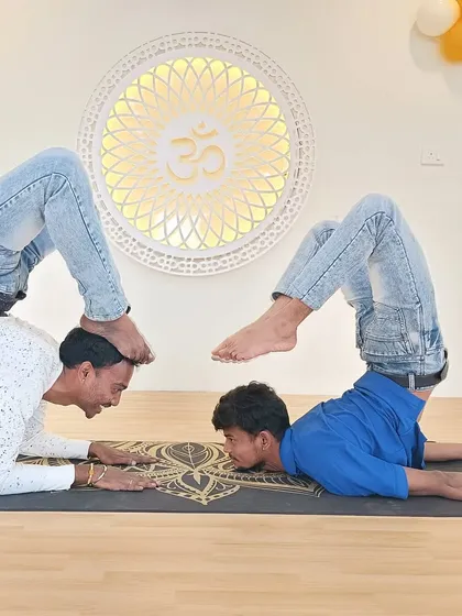 Another creative partner inversion, this time showing the playful and supportive nature of our Acro Yoga sessions.