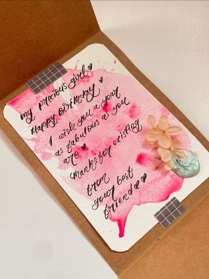 The inside of a custom card for a "precious girl" on her birthday. The pink watercolor wash makes the heartfelt message pop.