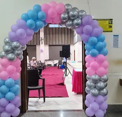A beautiful balloon arch in pink, purple, blue, and silver created a magical entryway for the 'Frozen' themed birthday party.