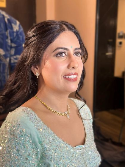 A final smiling portrait, her makeup looking perfect.