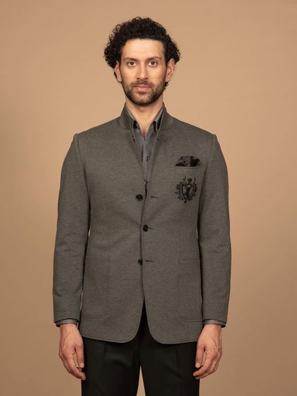 A front-on view of the grey bandhgala, showing its clean lines and structured fit. The premium fabric gives it a sophisticated finish.