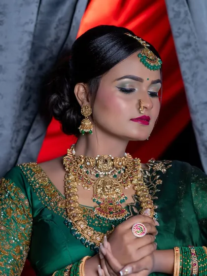 The eyes-closed shot, perfect for showing off the green and gold eyeshadow.