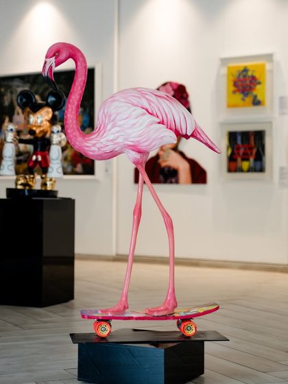 This sculpture captures the surreal balance between nature and urban life. A graceful flamingo, poised atop a pop-art skateboard, symbolizes navigating life's changes with elegance and motion.