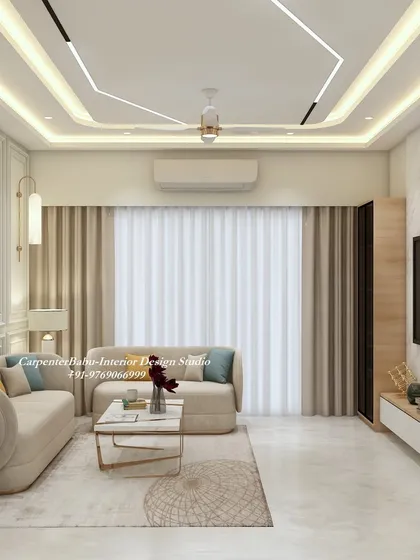 This view shows the interplay of different lighting sources, from the false ceiling LEDs to the hanging pendant lights, all working together to create a bright and welcoming living area.