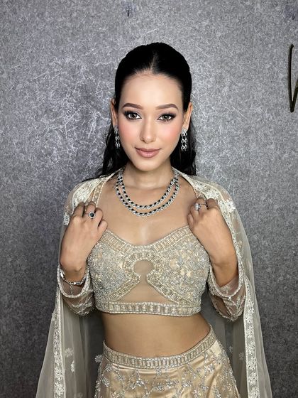 This client is ready for her close-up. The makeup is flawless and the sleek hair gives it a very modern and high-fashion feel.