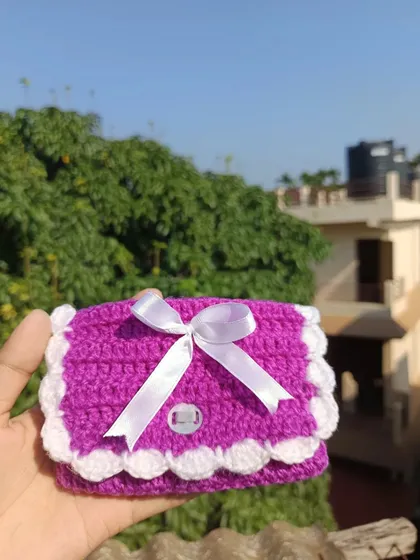 A vibrant purple mini purse with a white scalloped edge and ribbon. This was a custom color request that turned out beautifully.