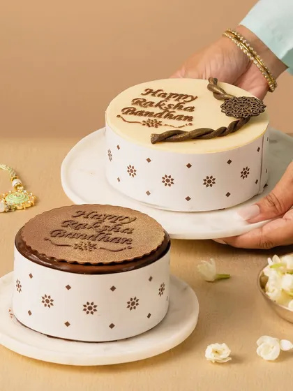 Here, we showcased a range of festive cakes. The composition feels like a real family table, with hands presenting the cakes in an inviting way. The styling is clean and lets the intricate chocolate work speak for itself.