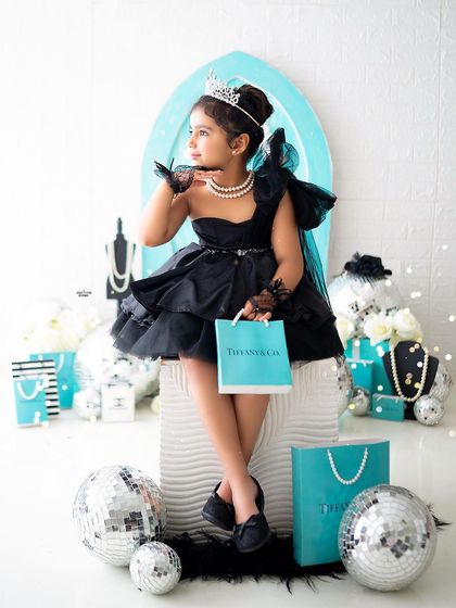Posing with her shopping bag, this little girl looks like she just stepped off a runway.