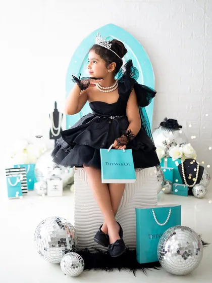 Posing with her shopping bag, this little girl looks like she just stepped off a runway.