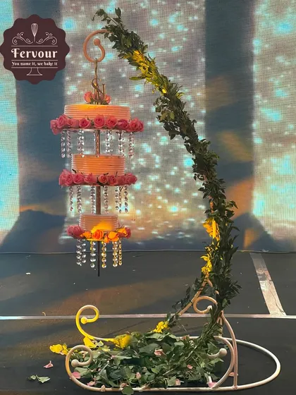For a truly spectacular wedding or engagement, I designed this breathtaking chandelier cake. The tiers hang elegantly from a custom stand, adorned with crystals and fresh flowers, creating an unforgettable centerpiece that tastes as good as it looks.