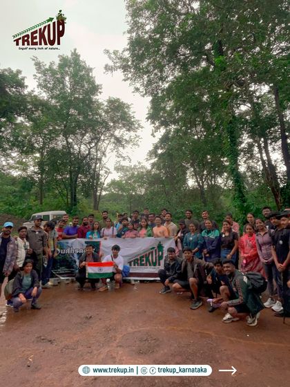 A full group photo with our Trekup banner after a successful trek. This is our adventure family.