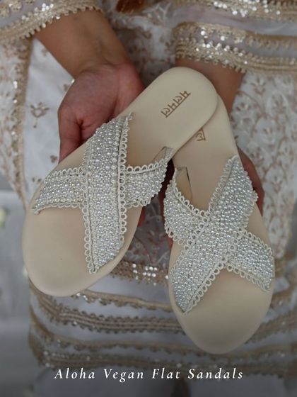My Aloha Vegan Flat Sandals are all about easy elegance. The criss-cross straps are fully embellished with pearls and beads, making them a chic and comfortable option for a beach wedding or a casual festive gathering.