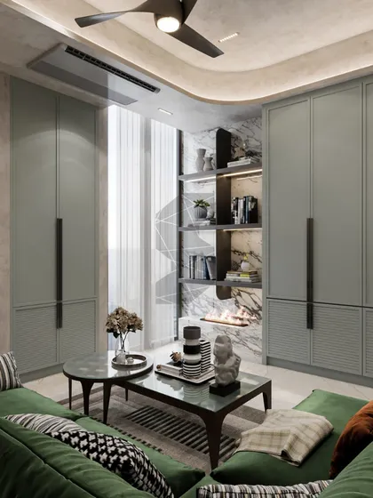 This view highlights the smart storage solutions in the guest and entertainment room. Floor-to-ceiling cabinets in a muted sage green offer ample storage, flanking a built-in display niche with an integrated fireplace, blending functionality with minimalist design.