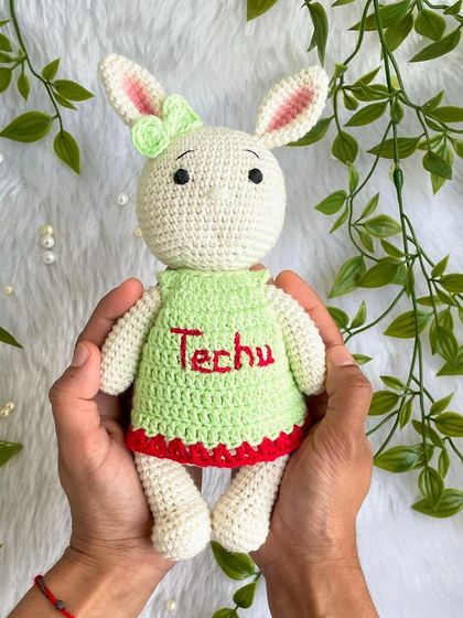 Another one of my popular bunny designs, this time in a lovely green dress with red trim, personalized with the name "Techu". I never get tired of making these sweet friends.