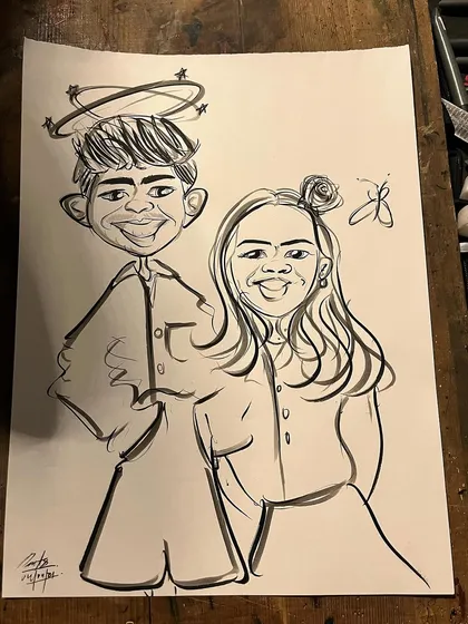 A duplicate of the playful young couple's caricature.