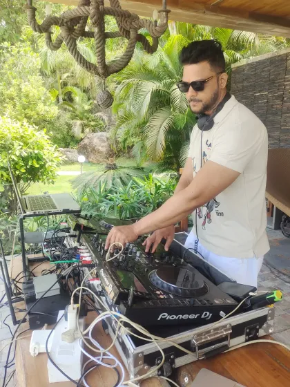 In my element, mixing tracks at an outdoor brunch party near Pawna Lake. Whether it's a local gig in Mumbai or a destination event, I bring my passion and equipment to create the perfect soundtrack.