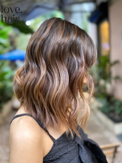A side view of the low-maintenance bob, showing the soft, face-framing waves.