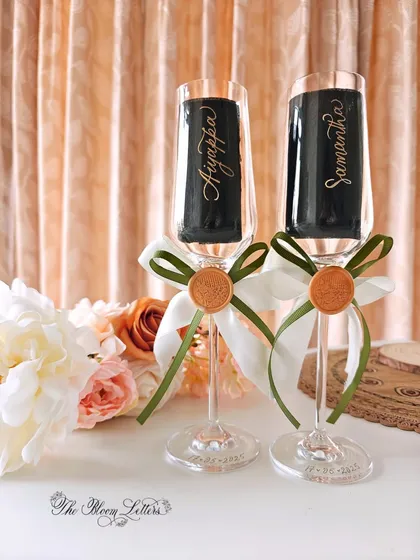 A toast to love, personalized with elegance. These champagne flutes are carefully hand-engraved with the couple's names and wedding date, creating a perfect keepsake for anniversaries and special celebrations.