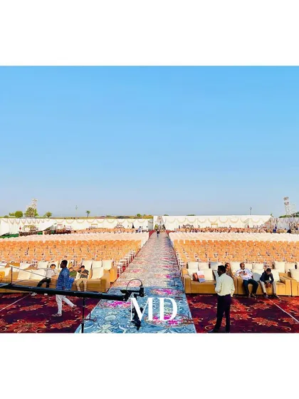 An early-stage view of the massive guest seating arrangement for a grand wedding. We provide and arrange all seating, including comfortable sofas for VIP guests, ensuring both style and practicality.
