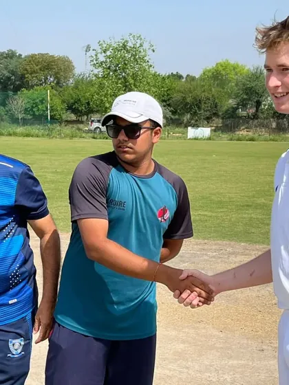 The pre-match handshake, a sign of respect and competition. We ensure our visiting teams feel welcome while providing a tough challenge on the field.