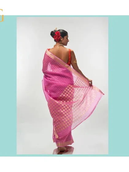 The back view of the mystic pink organza saree reveals the beautiful checkered pattern and the intricate design of the pallu.
