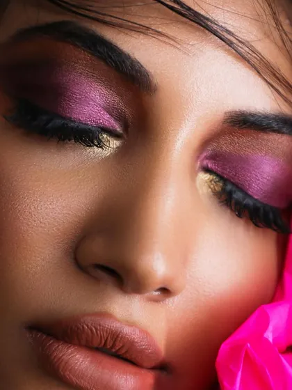 This look is all about the art of blending. The vibrant magenta and gold eyeshadows are seamlessly blended together to create a beautiful, multi-dimensional sunset eye.