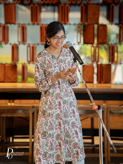 A smiling poet shares her work at our Pride event. The joy and safety in the room were palpable as we celebrated stories without shame.
