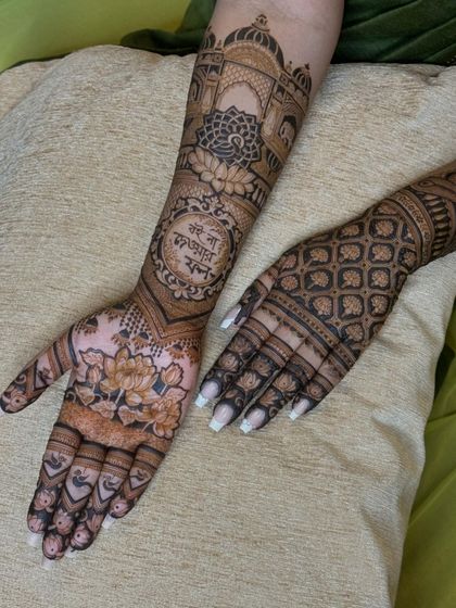 A full view of the design, with a floral pattern on one palm and a geometric pattern on the back of the other hand, showing versatility in style.