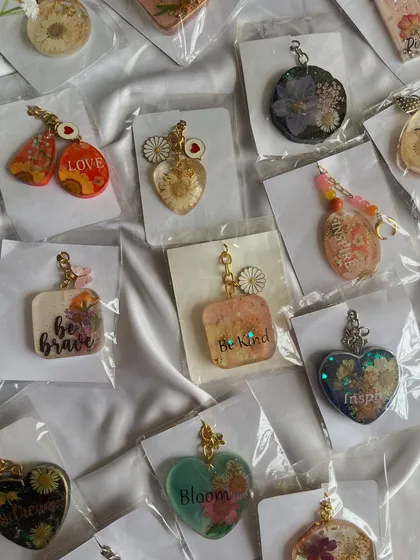 A beautiful assortment of my floral and quote keychains, all looking for new homes.